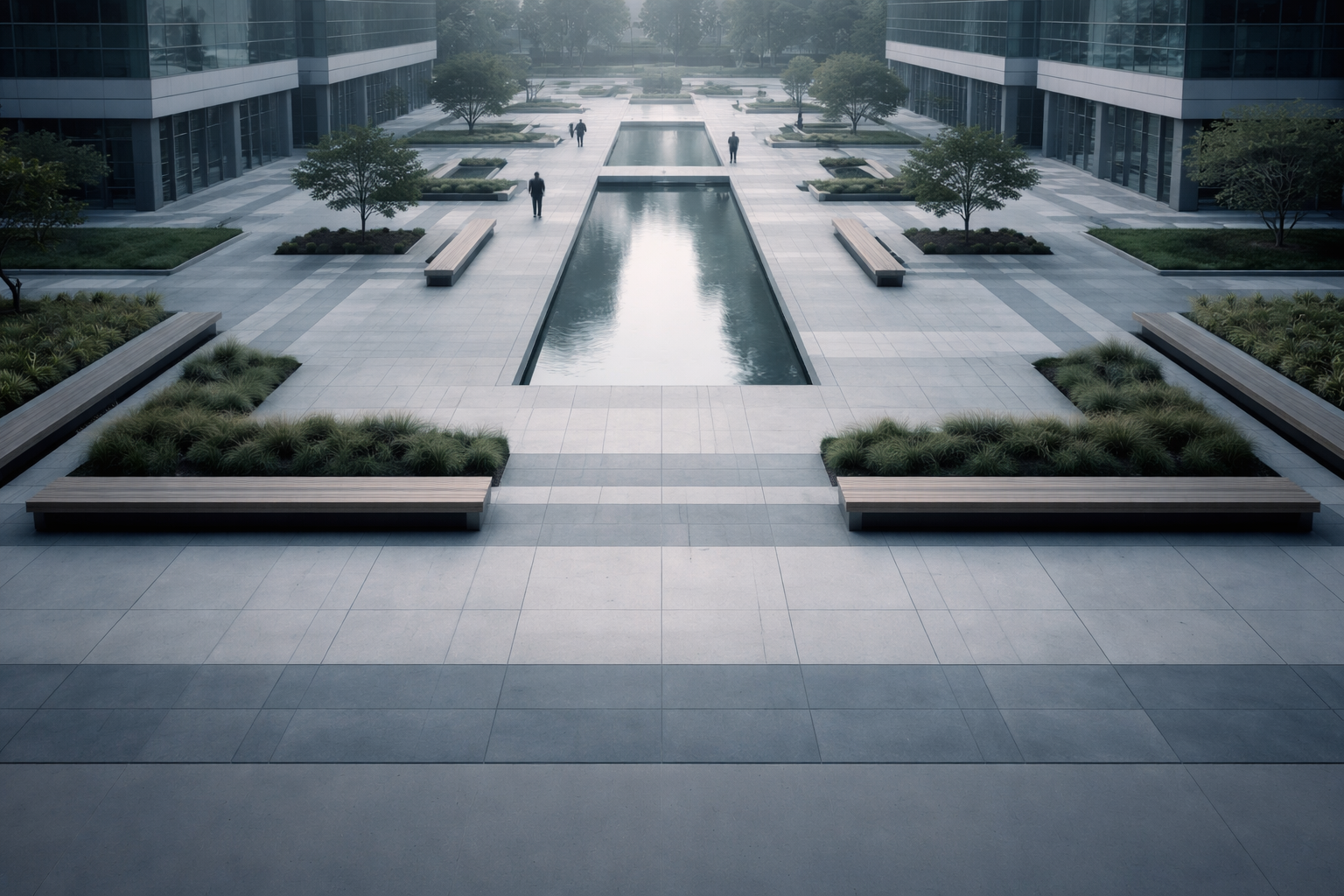 Aerial photo of a modern corporate plaza with geometric paving, a long reflecting pool and a few blurred anonymous figures clustered in the upper two-thirds; the lower third is left empty under soft dawn light.