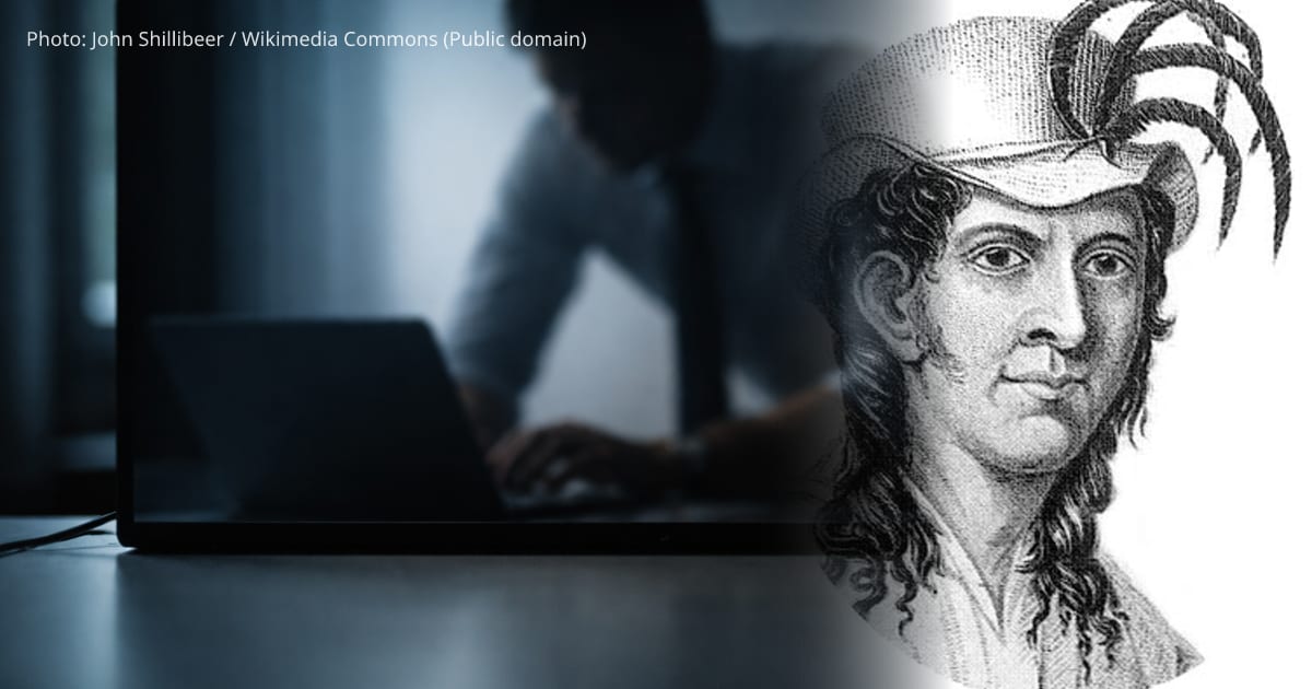 Thursday October Christian I — A soft, blurred reflection of a business person's profile and hands in a glossy laptop screen occupies the upper two-thirds, while the lower third shows a calm, empty desk surface.